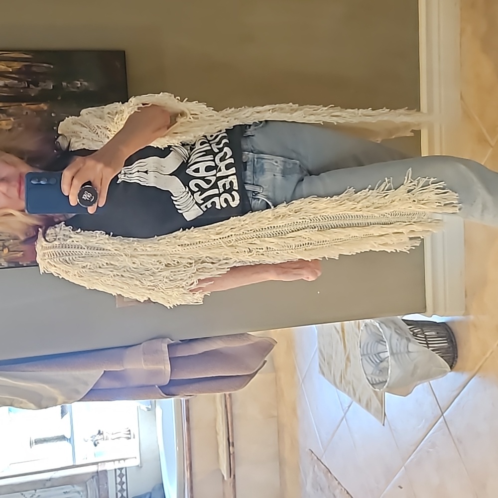 An off-white cardigan mid sweater